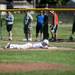 Saline right fielder Joey Sweigart lies in the dirt after being called out in the game against Bedford on Monday, June 3. Daniel Brenner I AnnArbor.com